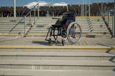 Rear view of man riding bicycle on street