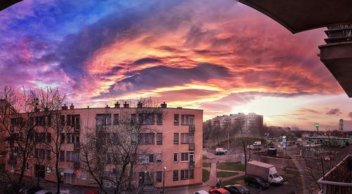 Panoramic view of cityscape against dramatic sky