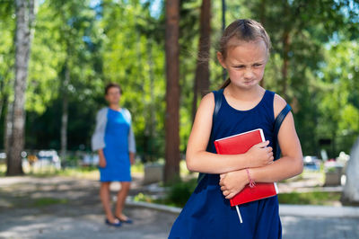 Portrait of girl standing outdoors