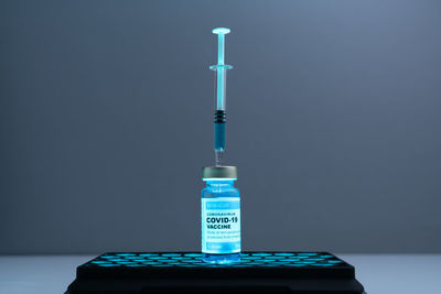 Close-up of illuminated lamp on table