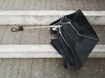 High angle view of damaged staircase on footpath