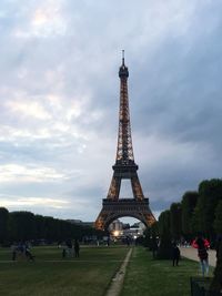 Silhouette of eiffel tower against cloudy sky