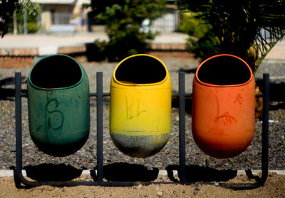 Close-up of multi colored garbage can