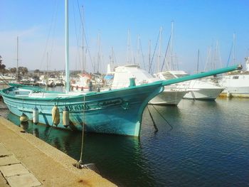 Boats moored at harbor