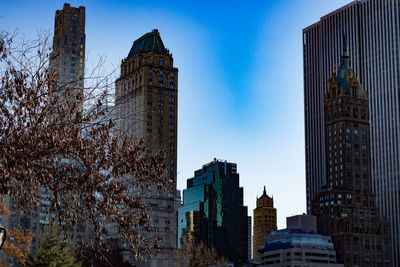 Low angle view of buildings against blue sky