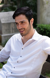 Portrait of young man standing outdoors