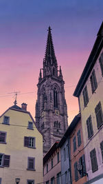 Low angle view of mulhousr cathedral  against sky during sunset