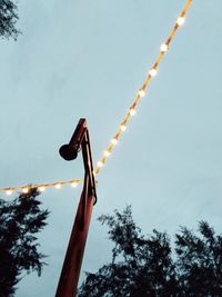 Low angle view of telephone pole against sky