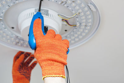 Cropped hand of person cleaning equipment
