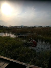 Scenic view of lake against sky during sunset