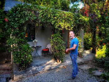 Rear view of man standing by tree