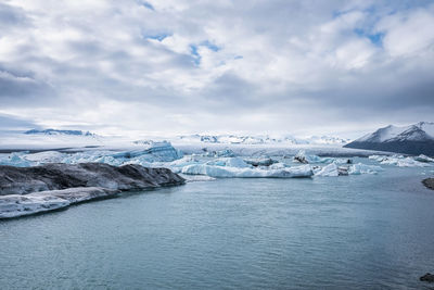 Scenic view of icebergs floating in jokulsarlon glacier lagoon against sky