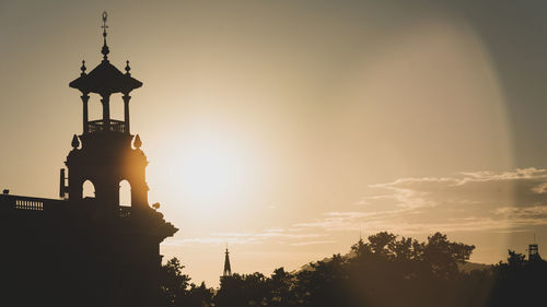 Low angle view of silhouette statue against sky during sunset