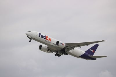 Low angle view of airplane against sky