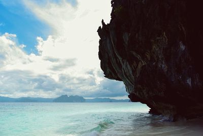 Scenic view of sea against cloudy sky