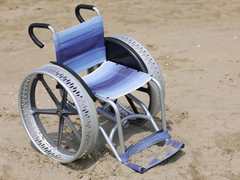 High angle view of deck chairs on beach