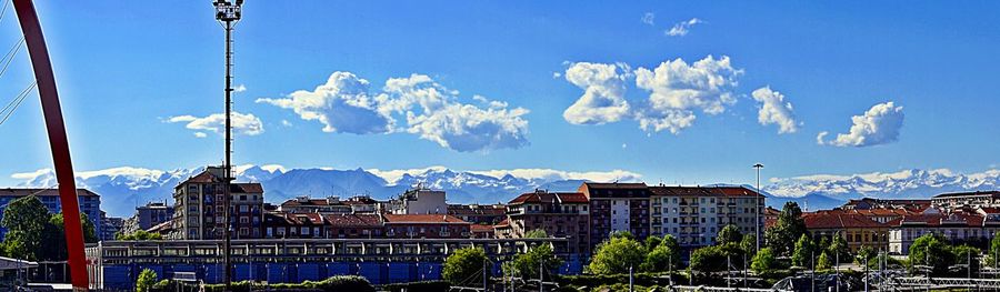 Panoramic view of city against blue sky