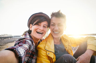 Portrait of lesbian couple at beach