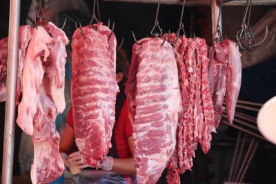 Close-up of meat hanging at market stall