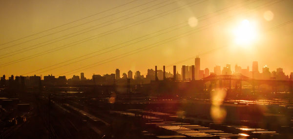 Cityscape against sky during sunset