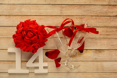 Close-up of red rose on table