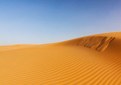 Scenic view of desert against clear sky