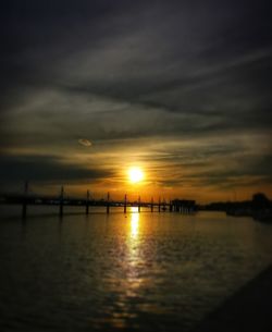 Scenic view of sea against sky at sunset