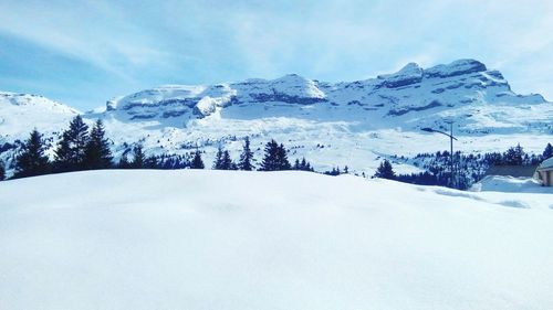 Scenic view of snow covered mountains