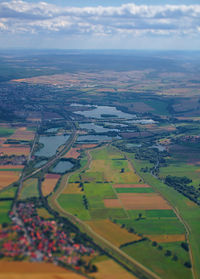 Aerial view of agricultural field against sky