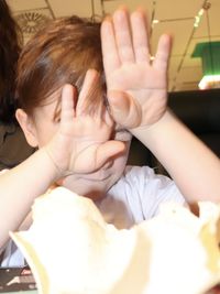 Close-up of mother and daughter in hands