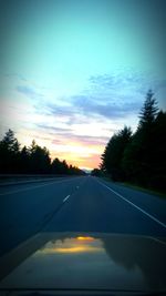 Road passing through forest