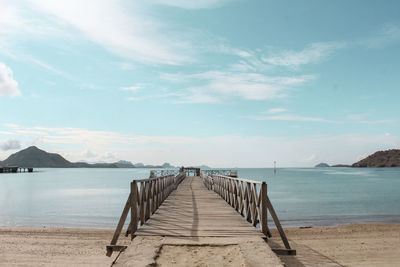 Pier over sea against sky