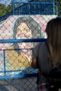 Portrait of woman with people in background