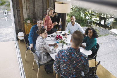 High angle view of business people discussing in portable office truck