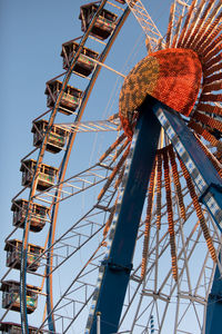 Low angle view of ferris wheel against sky