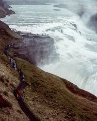 Scenic view of sea and mountains against sky