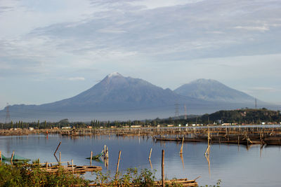 Scenic view of lake and mountains against sky