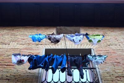 Clothes drying against blue wall