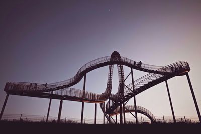 Low angle view of ferris wheel against sky