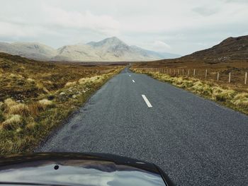 Road amidst landscape against sky