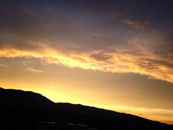 Scenic view of mountains at sunset