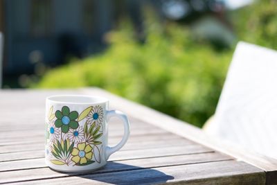 Close-up of coffee cup on table