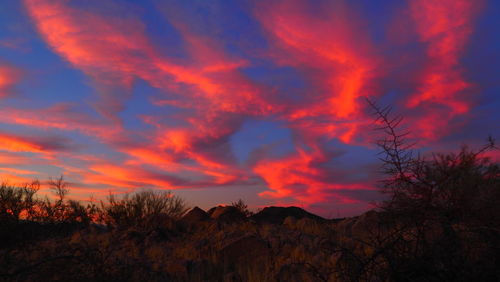 Scenic view of dramatic sky during sunset