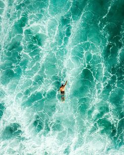 High angle view of man swimming in sea