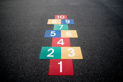 High angle view of colorful hopscotch drawn on street