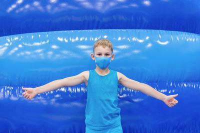 Full length of a boy swimming in pool