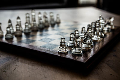 Close-up of chess pieces on table