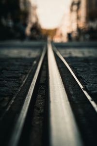 Surface level of railroad track during sunset