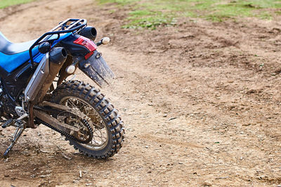 Bicycle parked on dirt road