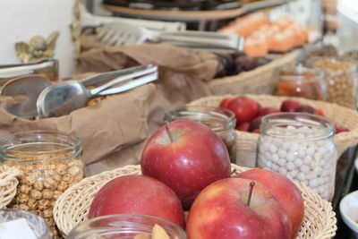 Close-up of apples in basket on table